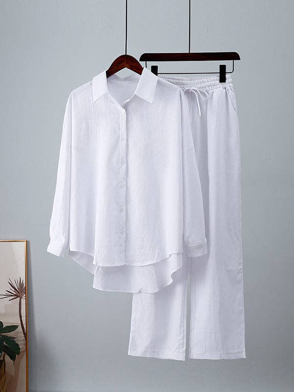 Plush Looks - Wholesale Set met top en broek (GEEN Loungewear) - Dames - Effen gekleurde splitjoint, hoge en lage mouwen, revers met knoopsluiting, top met trekkoord en elastische plooibroek aan de onderkant, set van twee stuks5