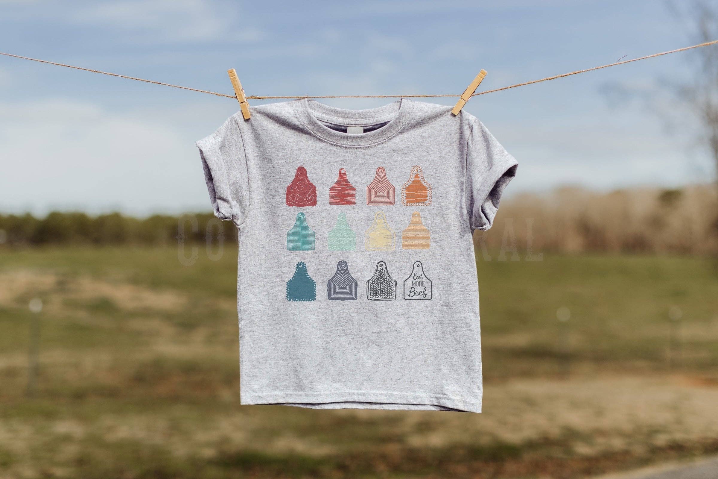 Ash Grey EAT MORE BEEF EAR TAGS YOUTH TEE for wholesale on Faire0