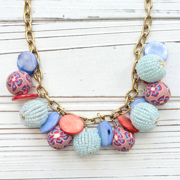 Coral and Blue Charm Necklace for wholesale by Lenora Dame