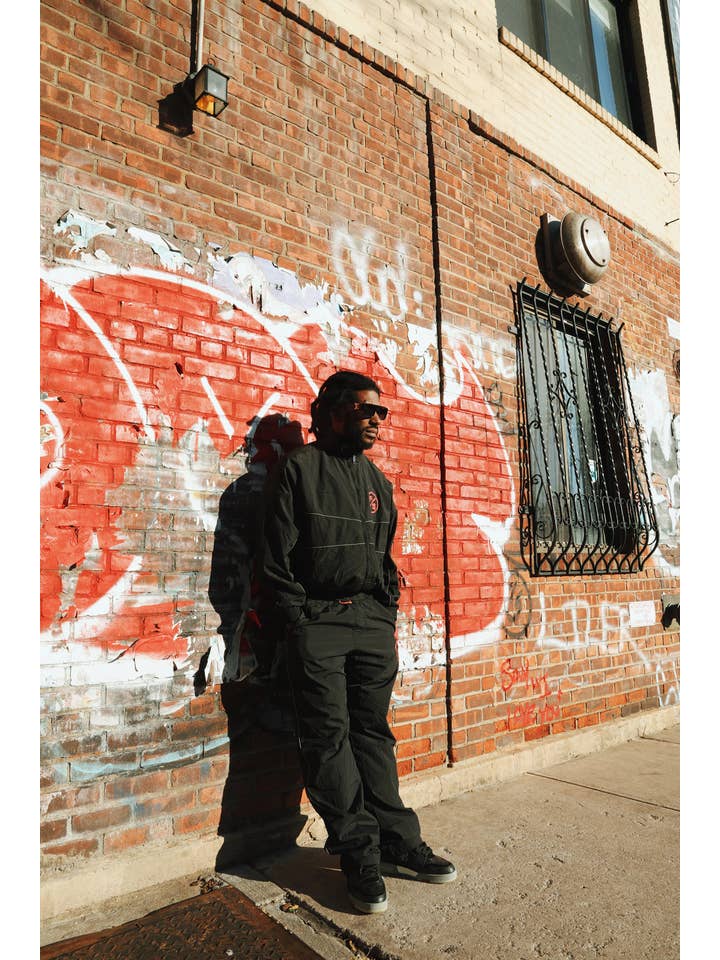 Black Red MOTION Nylon Pants (BRED) for wholesale on Faire6