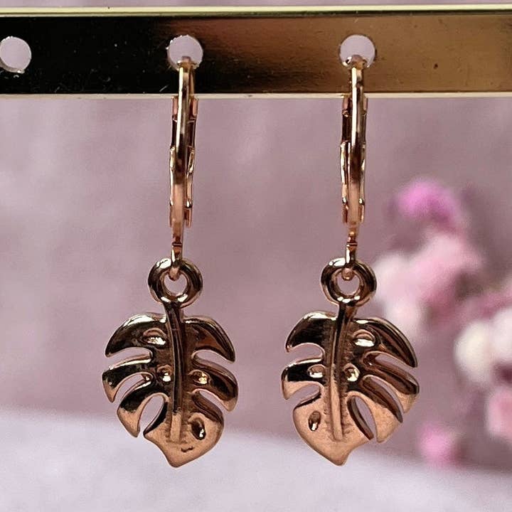 Rose gold earrings with Monstera leaf pendant and clasp for wholesale by plantyintroverts