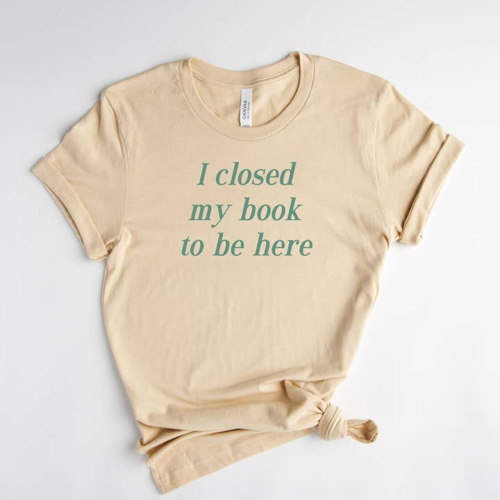 Soft Cream I Closed My Book To Be Here Tee for wholesale on Faire