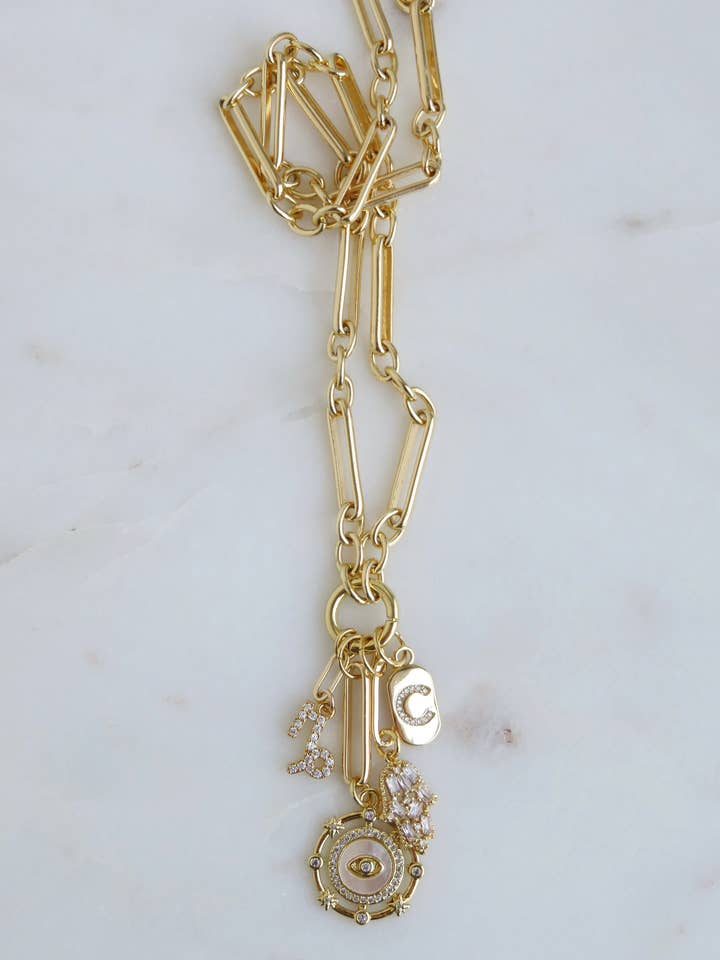 Personalized Zodiac Evil Eye Hamsa Celestial Charm Cluster Necklace - Figaro for wholesale by Boutique Suarez Co.