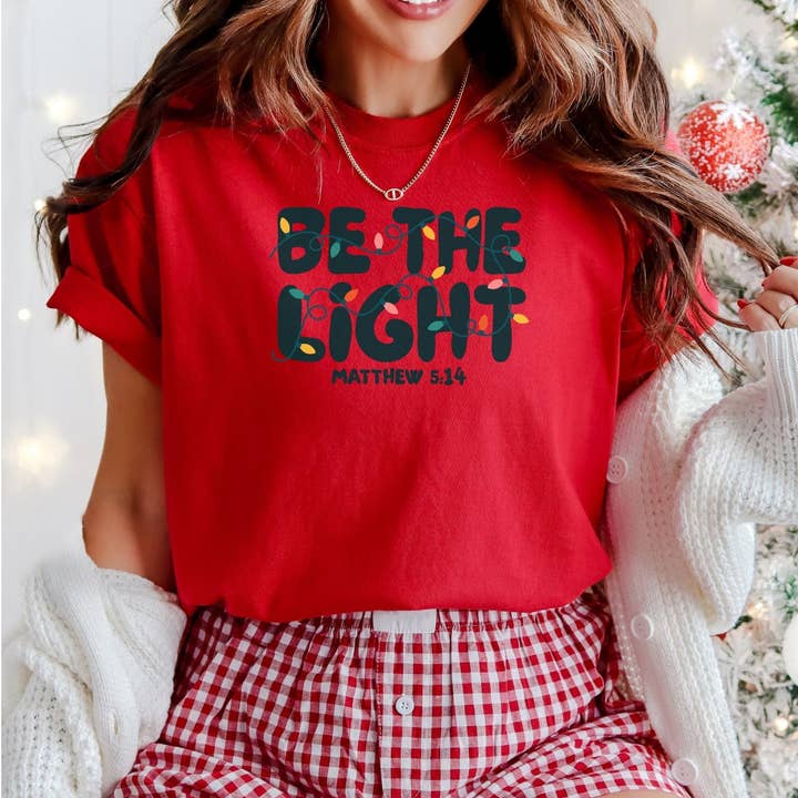 Be the Light | Matthew 5:14 || Christmas Unisex Tee for wholesale by Made By Yen