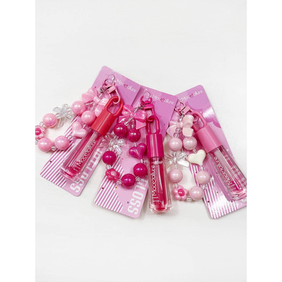 ROSE MULTI Porte-clés Charme Nœud Mignon avec Ensemble de Gloss à Lèvres Parfumé en vente sur Faire1