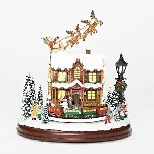 Lighted Musical Santa Over House w/Rotating Train for wholesale by Roman