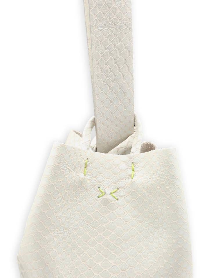 navigli bag | off-white snake-embossed upcycled leather with neon stitches for wholesale by VOLTA ATELIER