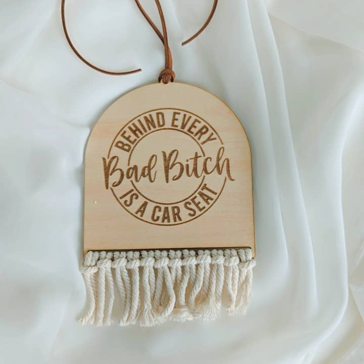 Off White Cord Behind Every Bad Bitch Is A Car Seat Car Charm for wholesale on Faire