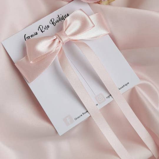 Pink satin hair bow clip for wholesale by Gracie Rose Bowtique