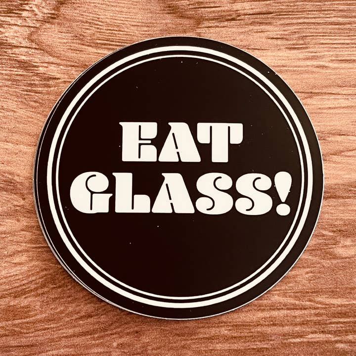 Eat glass! 3” snarky Funny sticker black white pop culture for wholesale by The Silver Spider