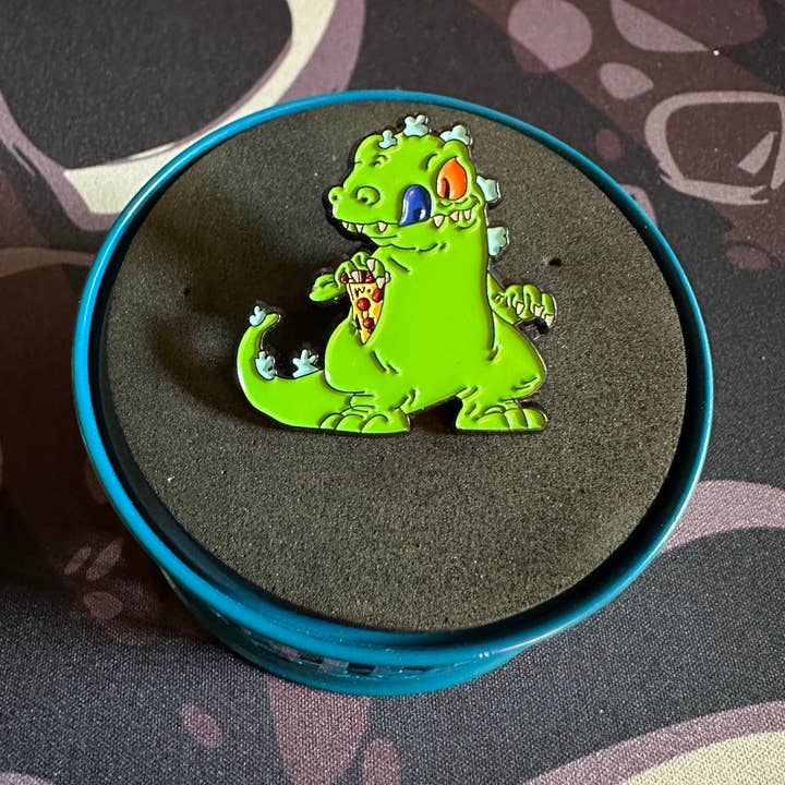 Scribble & Scroll – wholesale Lapel pin/button – Reptar - Rugrats - Dinosaur Eating Pizza Pin0