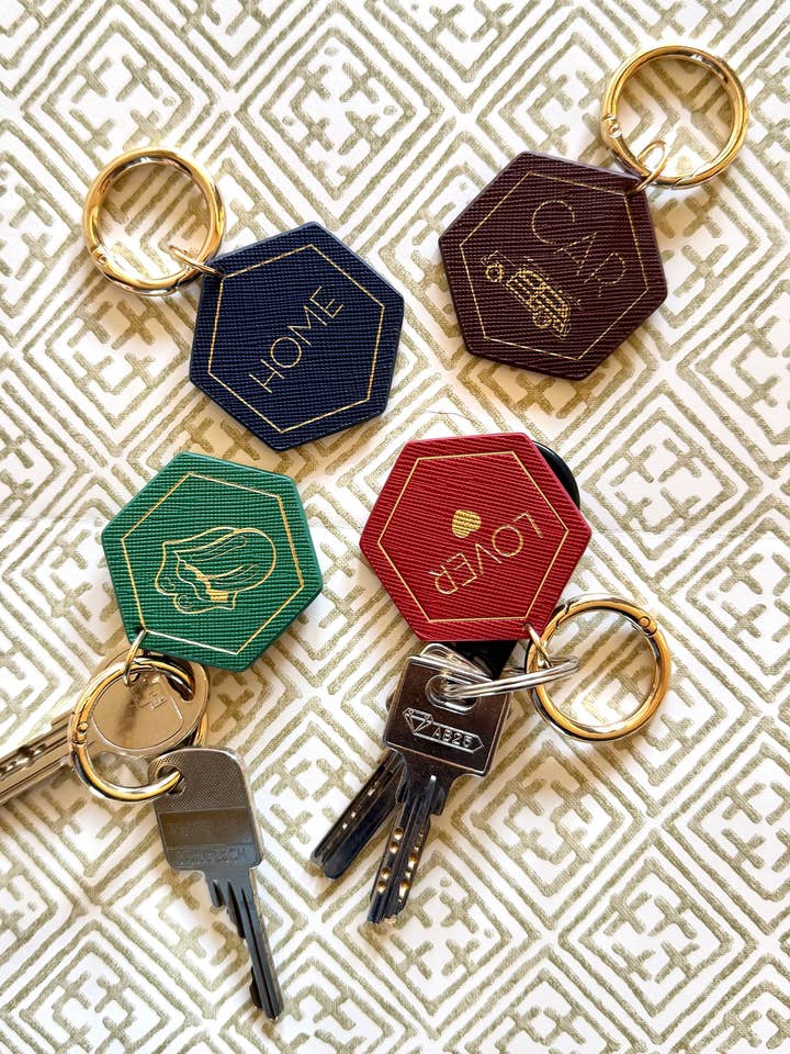 Ensemble de quatre porte-clés en cuir végétalien pour la vente par SLOANE STATIONERY