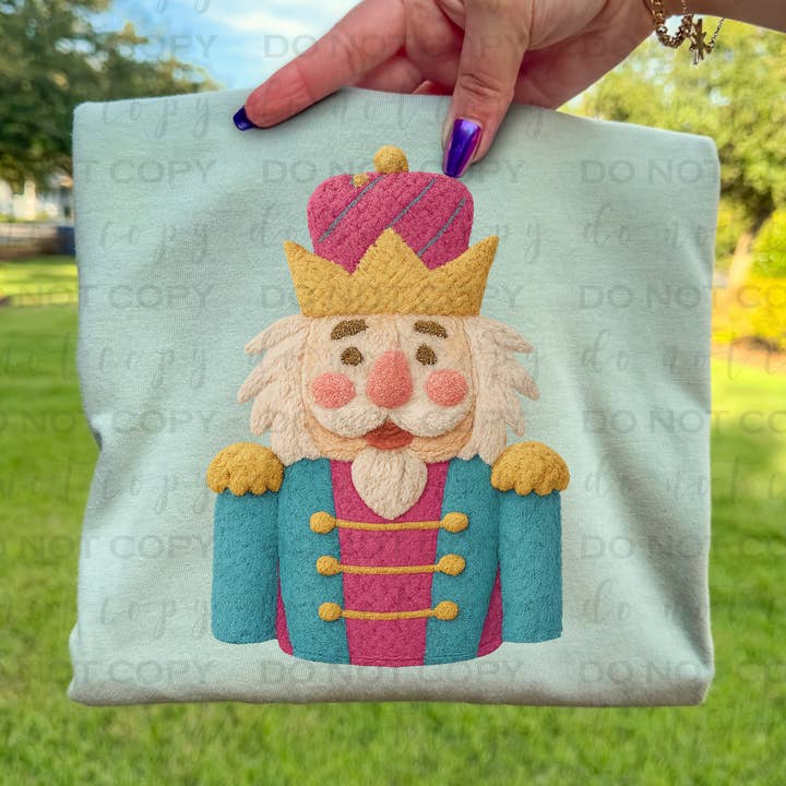 Pink And Blue Nutcracker Faux Yarn DTF Transfer for wholesale by 403 Designs