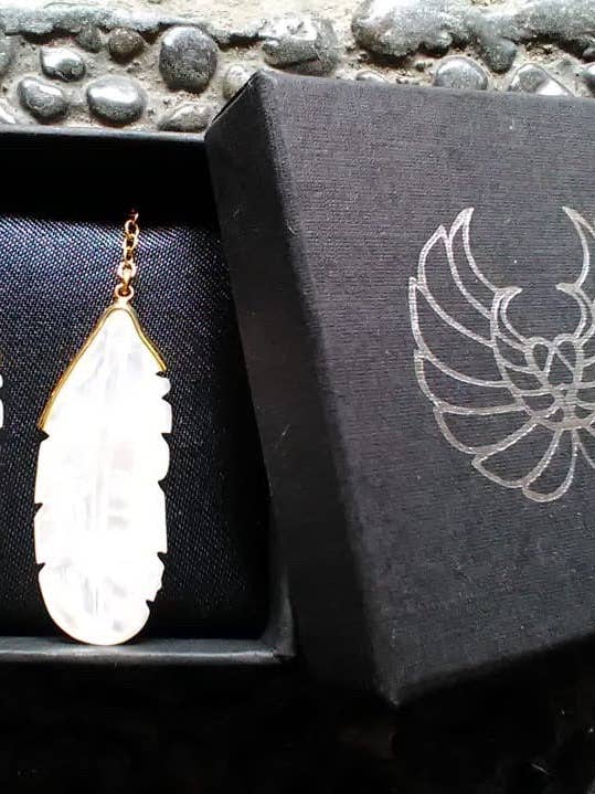 Shell carved earrings of an owl feather for wholesale by sundaricreations