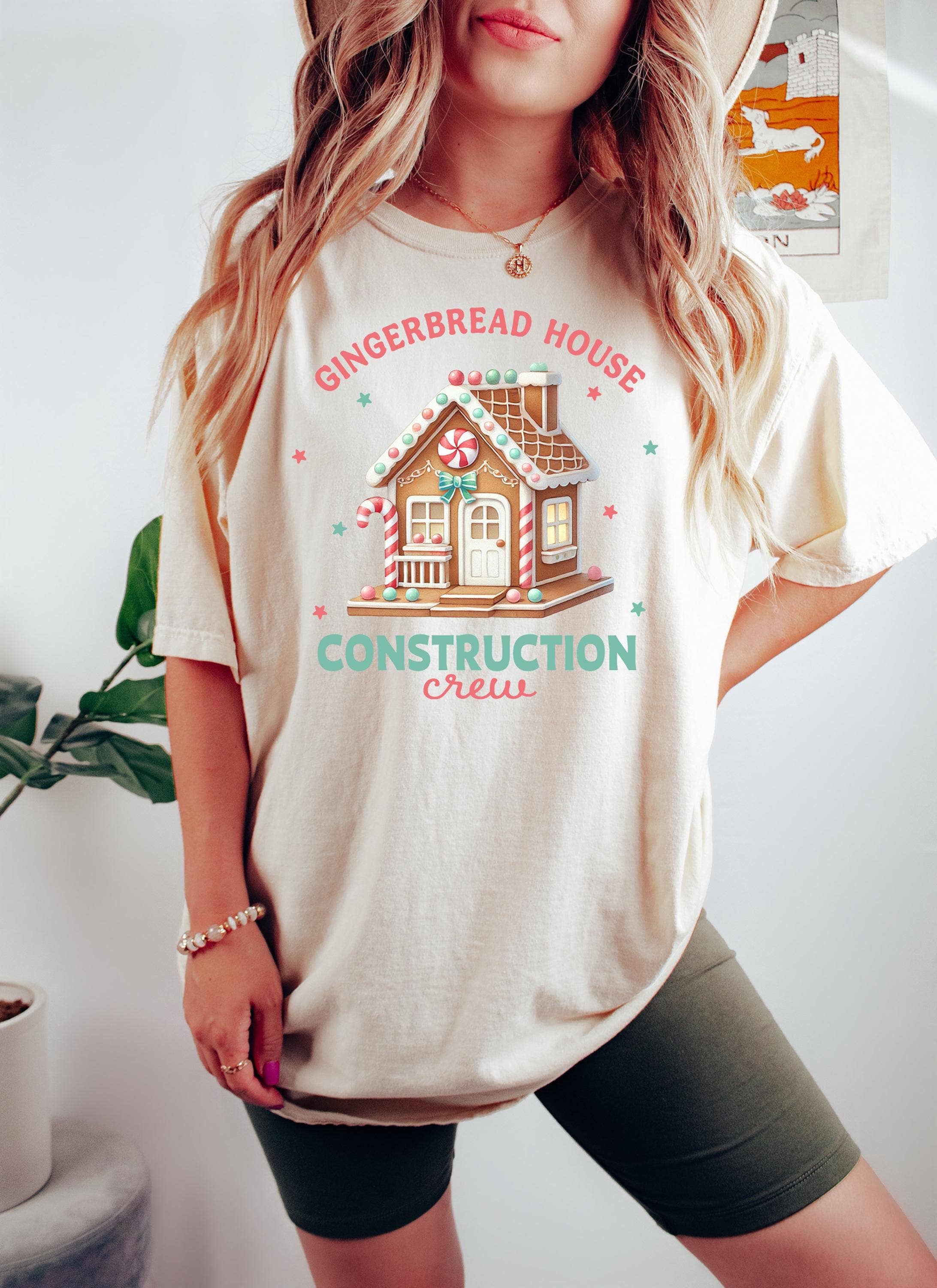 NVC Ecommerce LLC – wholesale T-shirt (graphic) – women's – Gingerbread House Shirt, Christmas Construction Crew Sweater1