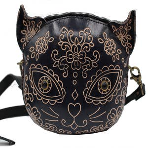 Purchase Wholesale sugar skull purse. Free Returns & Net 60 Terms on Faire