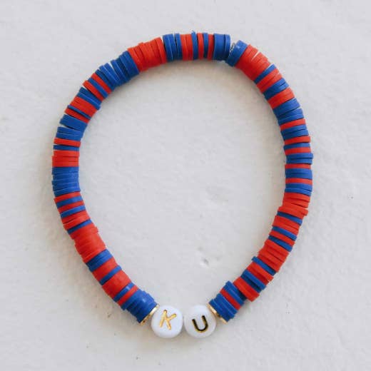 Bracelet rouge et bleu KU pour la vente par Carly Rae Studio