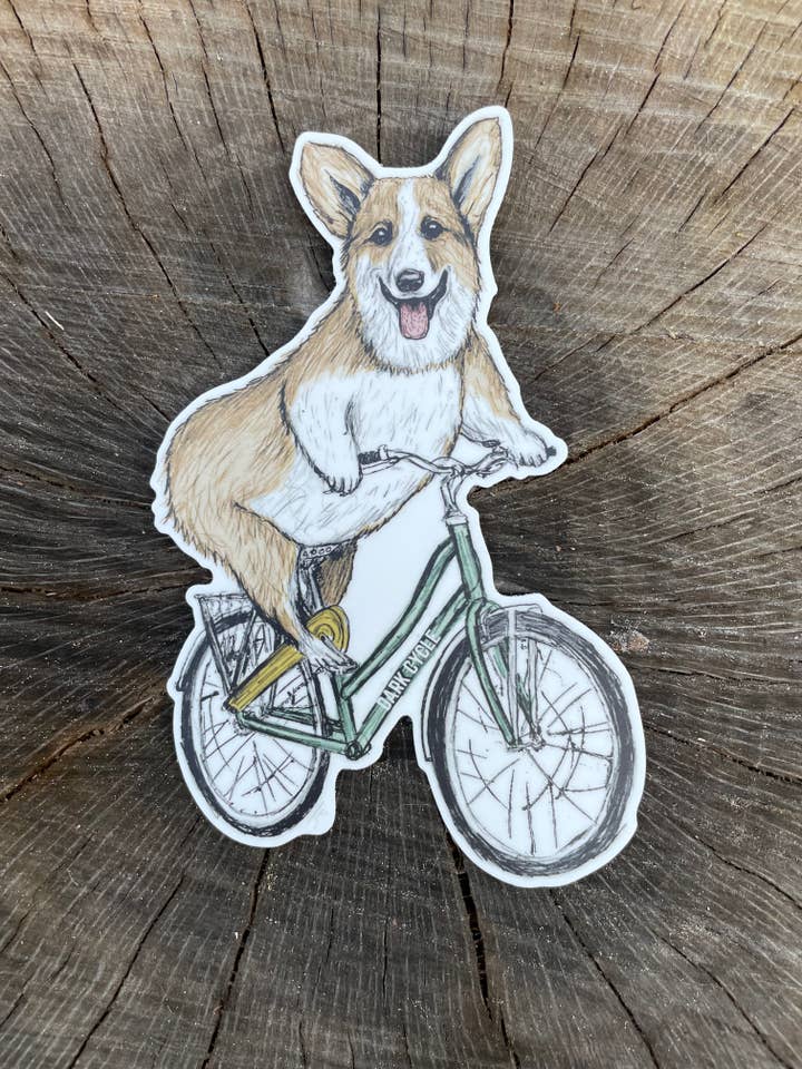 Corgi On A Bicycle Vinyl Sticker for wholesale by Dark Cycle Clothing