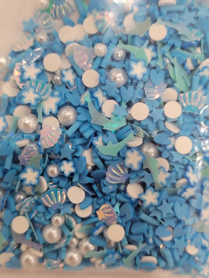 SAC À SAUPOUDRER DOLPHIN & SHELLS DE 1 oz pour la vente par Waterman's Loft Inc.