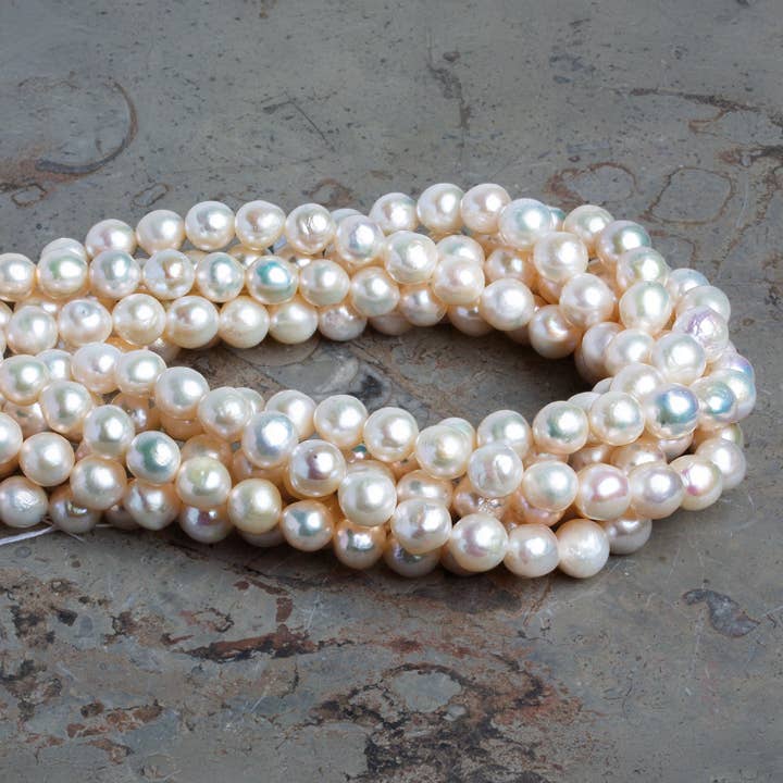 8mm White Off Round Pearls 15 inch 49 beads for wholesale by The Bead Traders