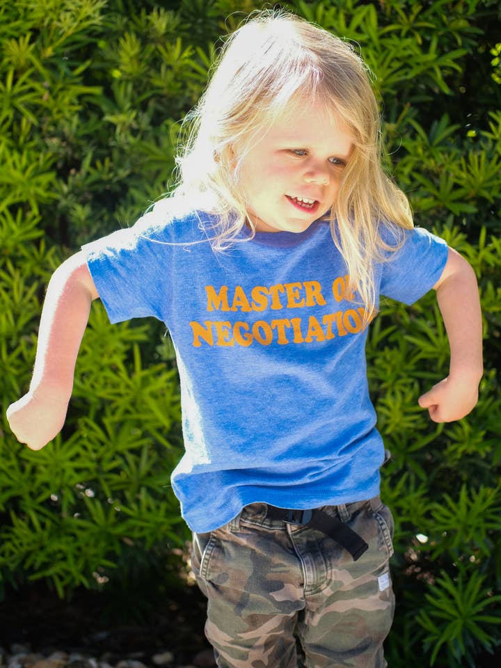 Vintage Blue Master of Negotiation | Kids Graphic Tee | Sizes 2T - YL for wholesale on Faire