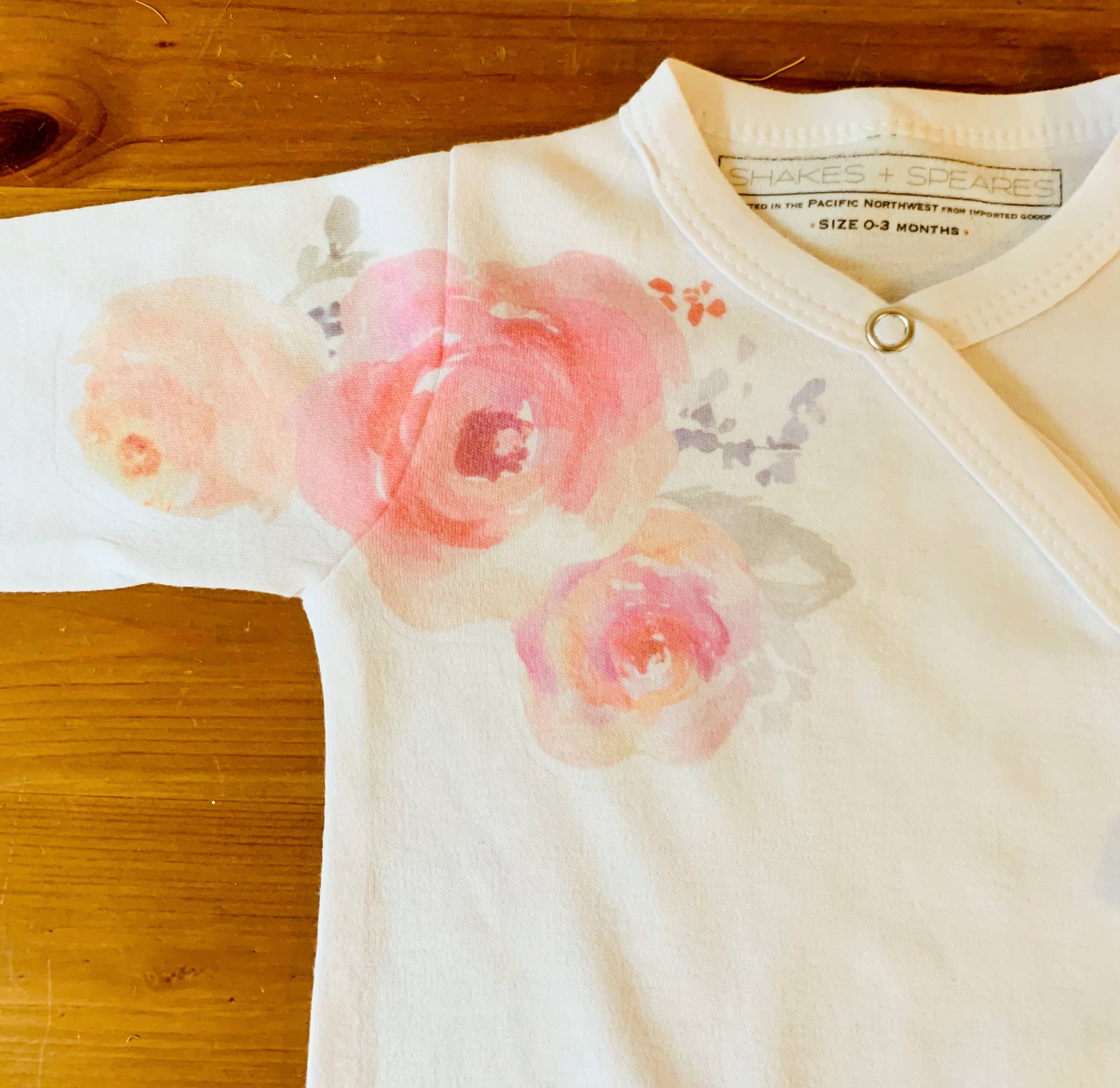 Cloud White Baby Footed Romper - Watercolor Flowers for wholesale on Faire1