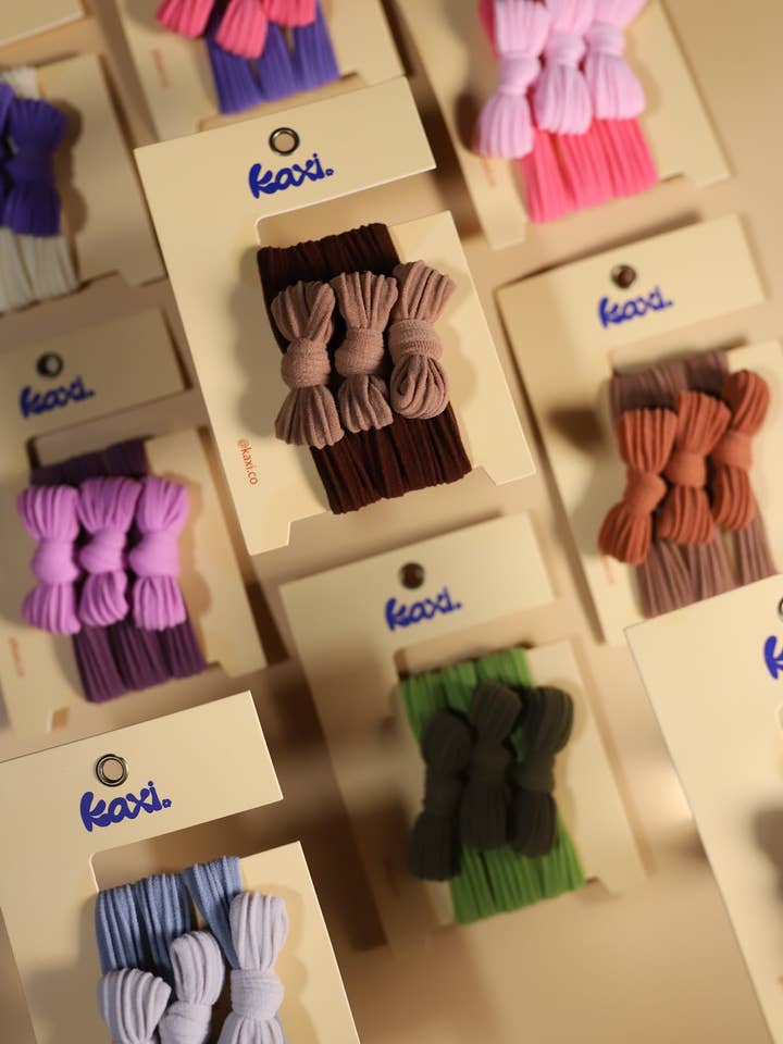 TWO TONED BOW SLICK BACK PONYTAILS for wholesale by KAXI