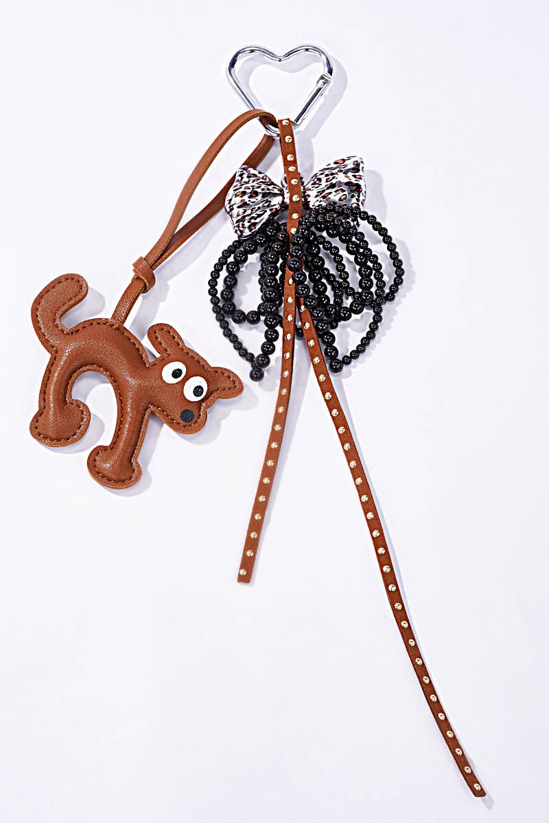 Brown Grigri bag accessories and keychain Dog and bow PC57 for wholesale on Faire