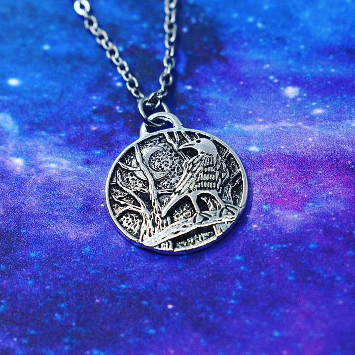 Necklace with raven and crescent moon for wholesale by JorieJewelry