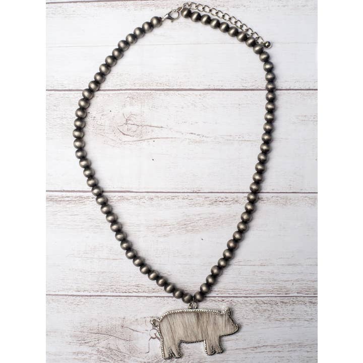 Grey RAISED IN A BARN WHITE COWHIDE SHOW PIG PENDANT NAVAJO PEARLS NECKLACE for wholesale on Faire