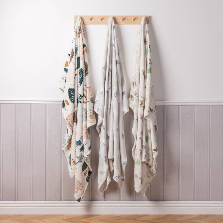 Classic Peter Rabbitâ„¢ Throw Natural for wholesale on Faire