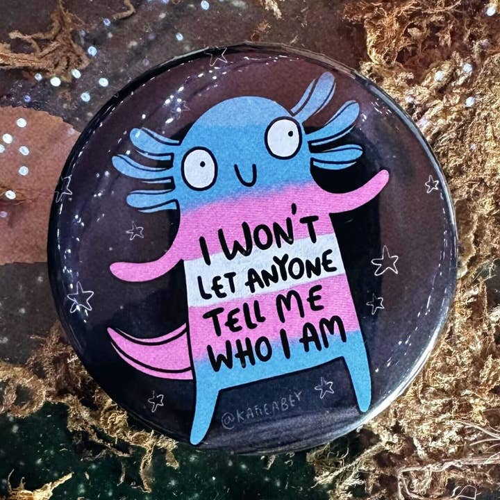 I Wont Let Anyone Tell Me Who I Am Axolotl Trans Pride Badge for wholesale by Katie Abey