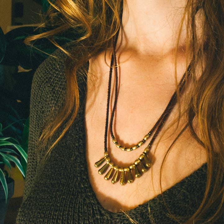 Layered statement necklace with brass beads and leather for wholesale by Nomadu