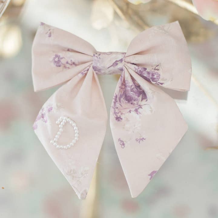 Elle Initial Pearl Bow for wholesale by Bebe Theory