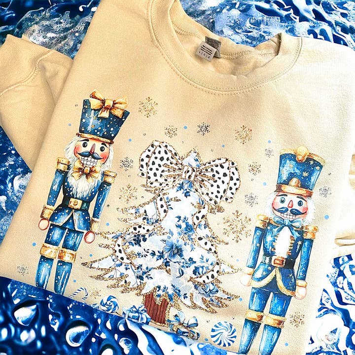 Blue Nutcracker Christmas Sweatshirt in Sand Color for wholesale by Lasting Impressions CT