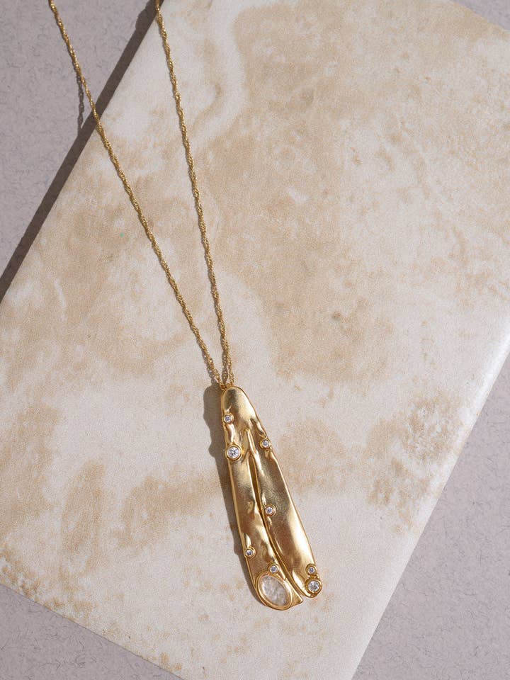 Organic Clear Petal Pendant Necklace for wholesale by Rare Matters Jewelry