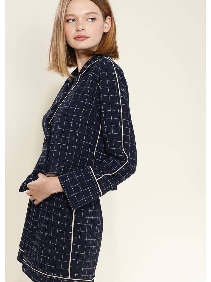 Nurode's Grid Print Blouse in Navy Plaid for wholesale on Faire