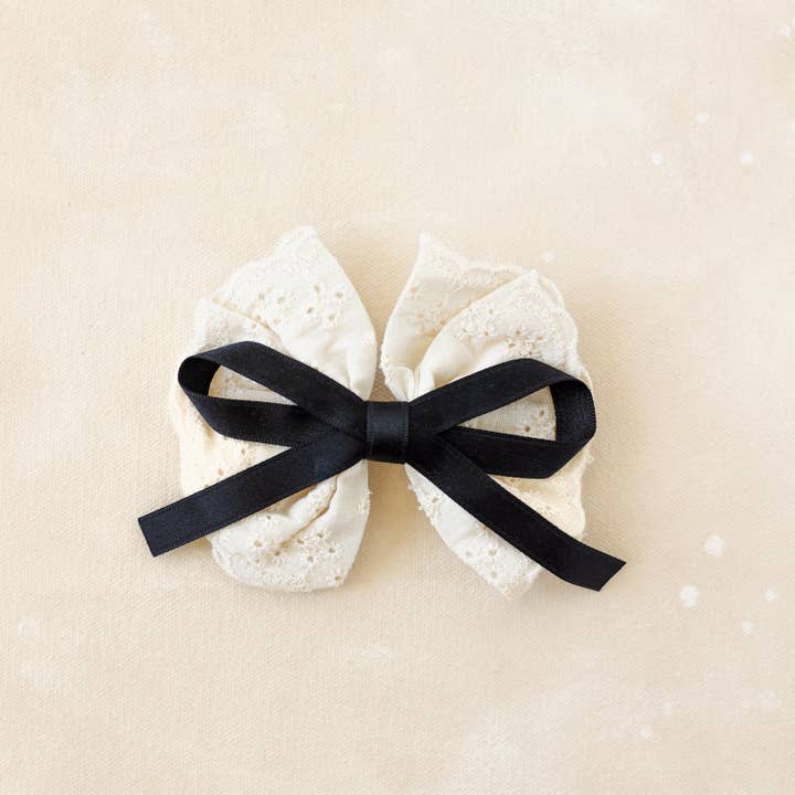Black Bow Barrette// Della for wholesale on Faire