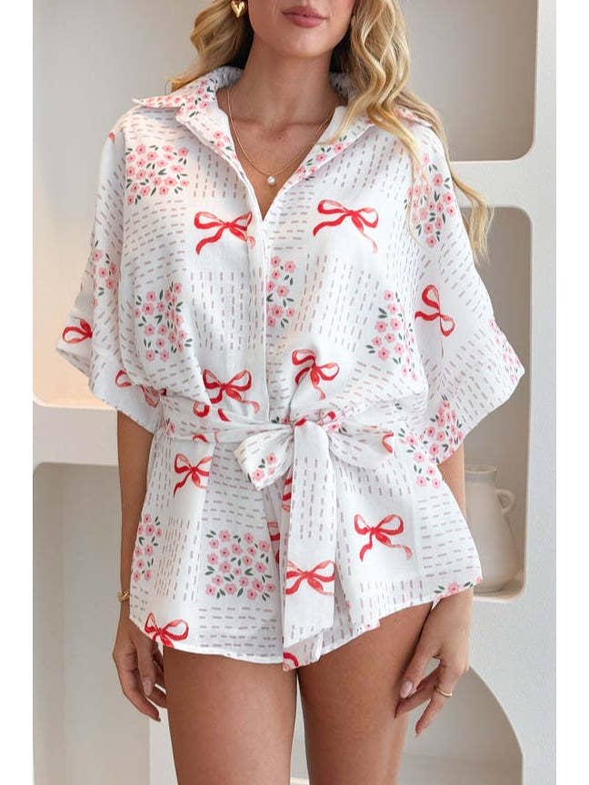 Bow printed oversized Button short sleeve romper in red for wholesale on Faire
