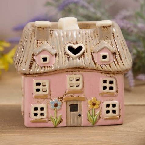 Steingut Rosa Strohdachhaus mit geprägten Blumen Wachsschmelzbrenner für den Großhandel von Langs