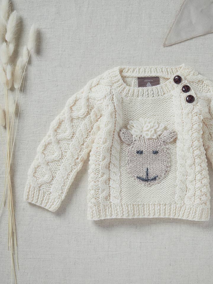 Jersey Shepley Character Baby de lana Aran con cuello redondo, color crema para venta al por mayor de Aran Woollen Mills