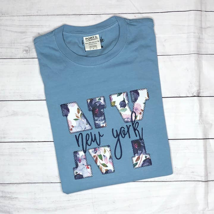 State Abbreviation and Name Applique Short Sleeve TShirt for wholesale by Handmade Pieces Company LLC