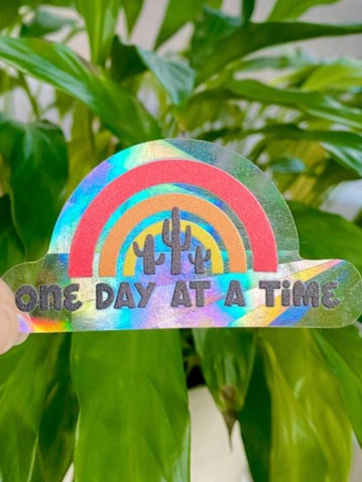 One Day At A Time Rainbow Suncatcher Sticker 3x1.5 in. for wholesale by taelormade