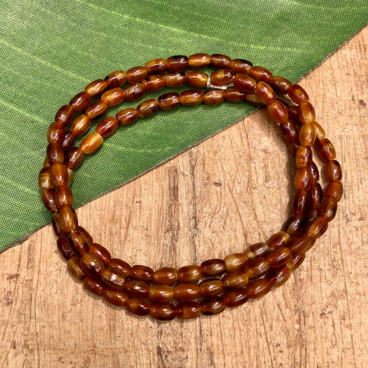 Vintage Brown & Cream Glass Tiny Oval Beads for wholesale by Bead Goes On