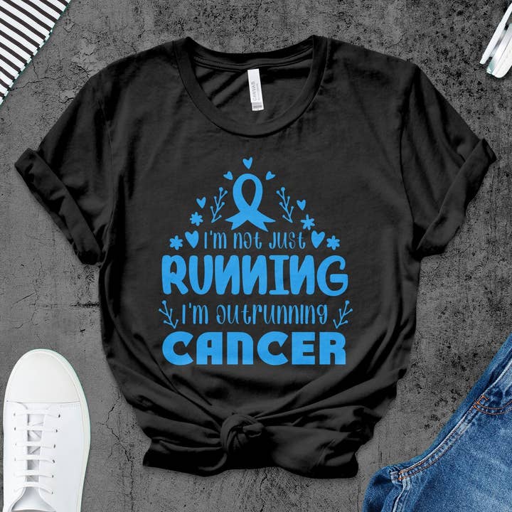Inspirational Cancer Awareness T-Shirt, Outrunning Cancer Supportive Apparel, Motivational Running Shirt for Charity Events for wholesale by FreakyTeeFactory