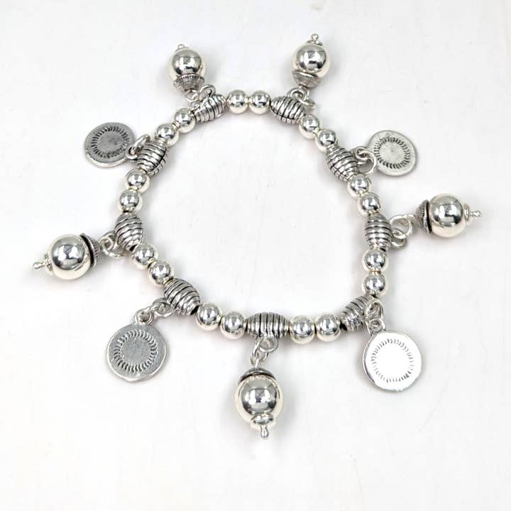 Beaten circle pendants on beaded bracelet for wholesale by Tempest Designs