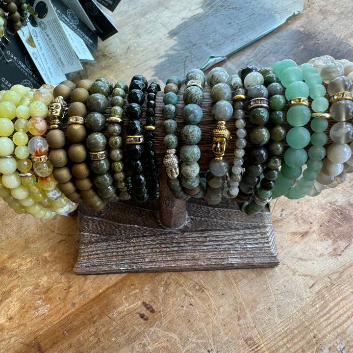 The Greens & Yellows Stacker Set - 20 Bracelets for wholesale by Rebecca Dolber