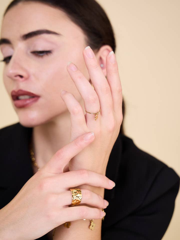 Charmed Enchantment Four-Leaf Clover Flower Ring in Stainless Steel for wholesale by BELLISSIMA BIJOUX