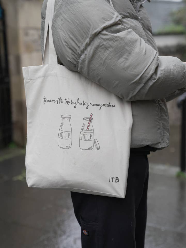 ‘The Owner of This Tote Bag Has Big Mommy Milkers’ Tote Bag by Tom’sTotes for wholesale by Tom'sTotes Ltd