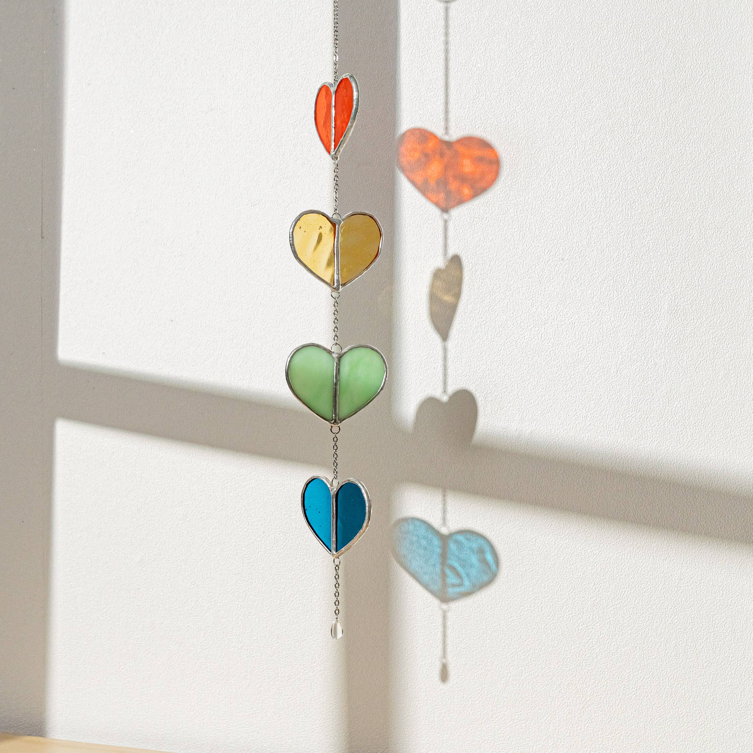 MondoBellissimo - Vendita all'ingrosso Bandierine/Ghirlande - Ghirlanda a cuore in vetro colorato F225